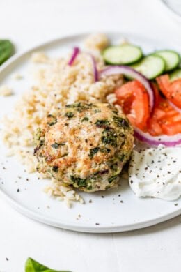 greek turkey burger on a plate with rice