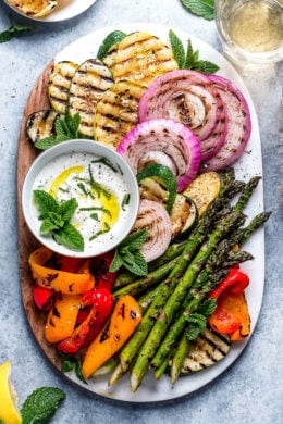 Grilled Vegetables with Yogurt Mint Sauce is so colorful and delicious. An easy summer side dish made with asparagus, zucchini, squash, red onion and bell peppers.