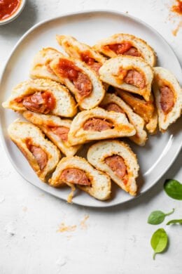 sliced sausage rolls on a plate